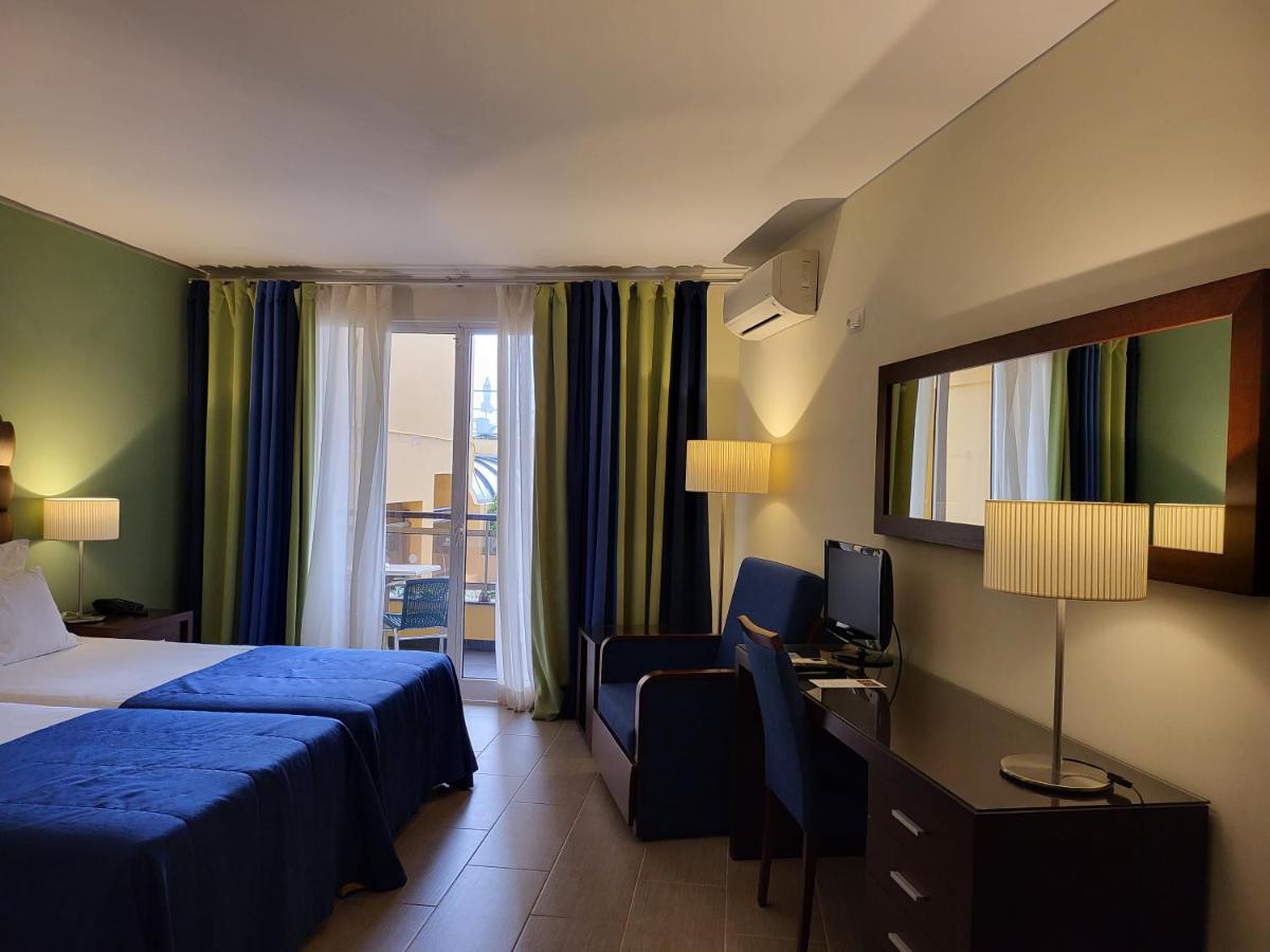 Uma cama ou camas num quarto em Hotel Cais da Oliveira