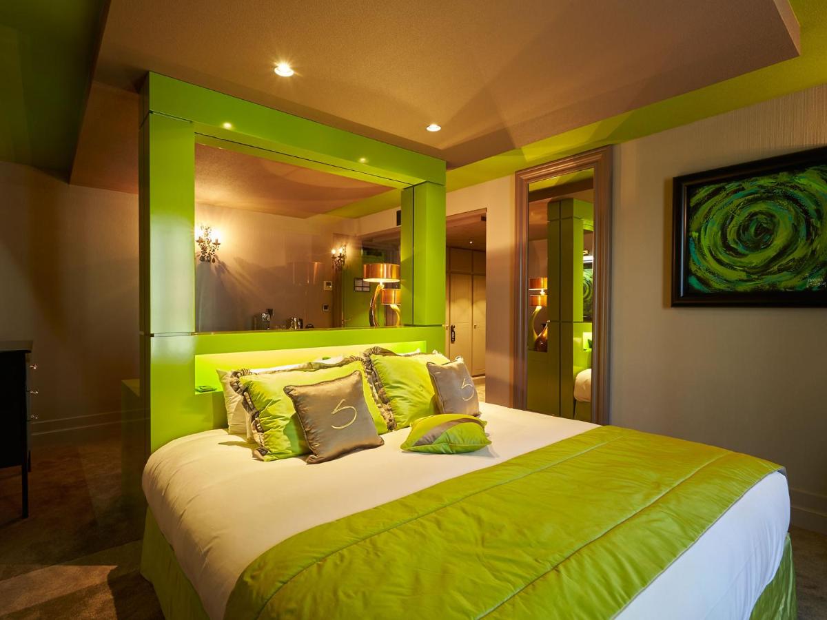 Un ou plusieurs lits dans un hébergement de l'établissement Le Stelsia Resort