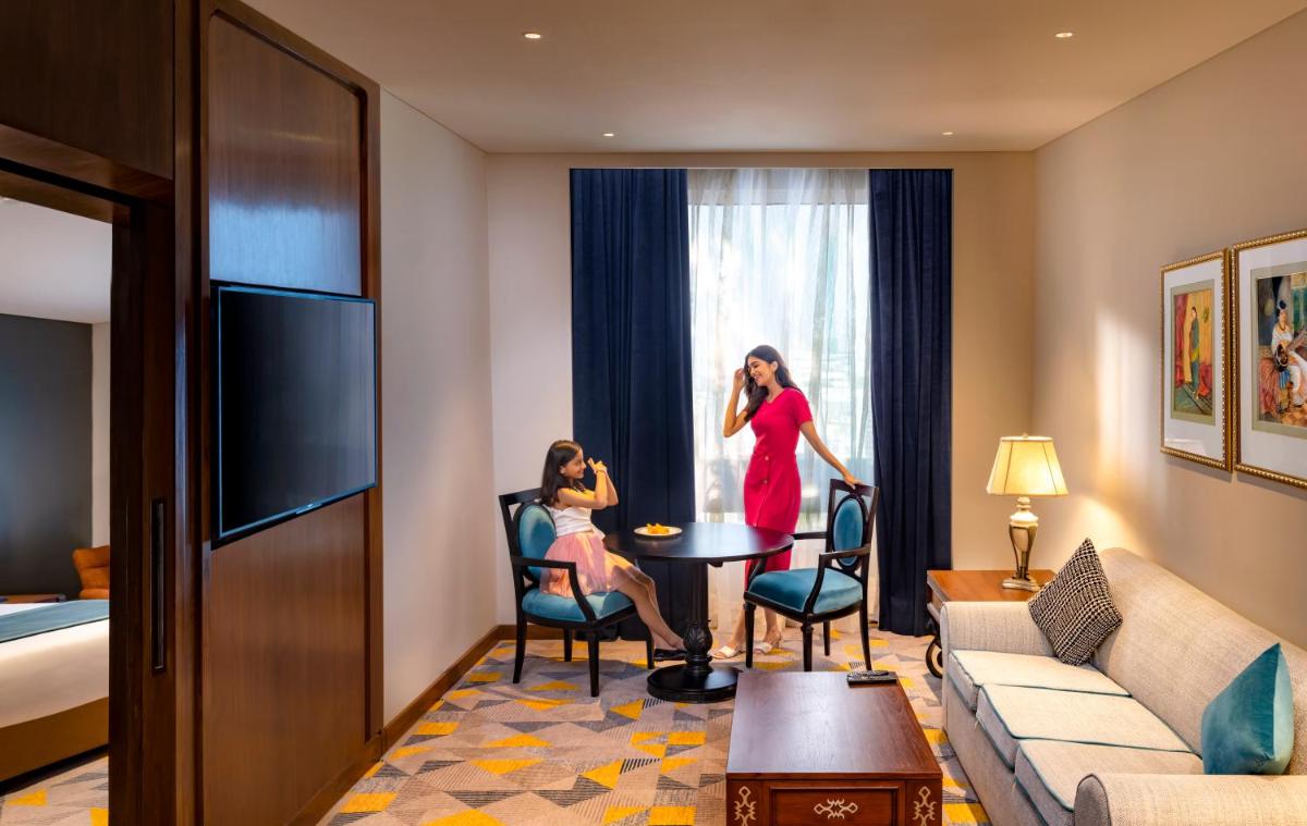 two women standing in a hotel room at Welcomhotel by ITC Hotels, Cathedral Road, Chennai in Chennai