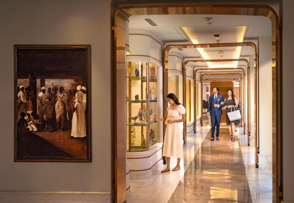 a couple looking at a painting in a museum at Welcomhotel by ITC Hotels, Cathedral Road, Chennai in Chennai