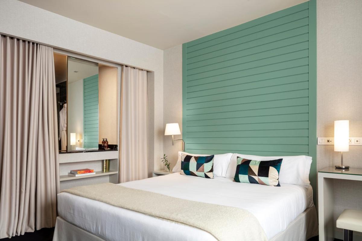 Cama o camas de una habitación en Hotel Miró