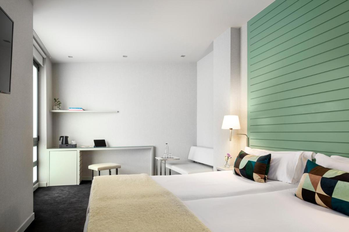 Cama o camas de una habitación en Hotel Miró