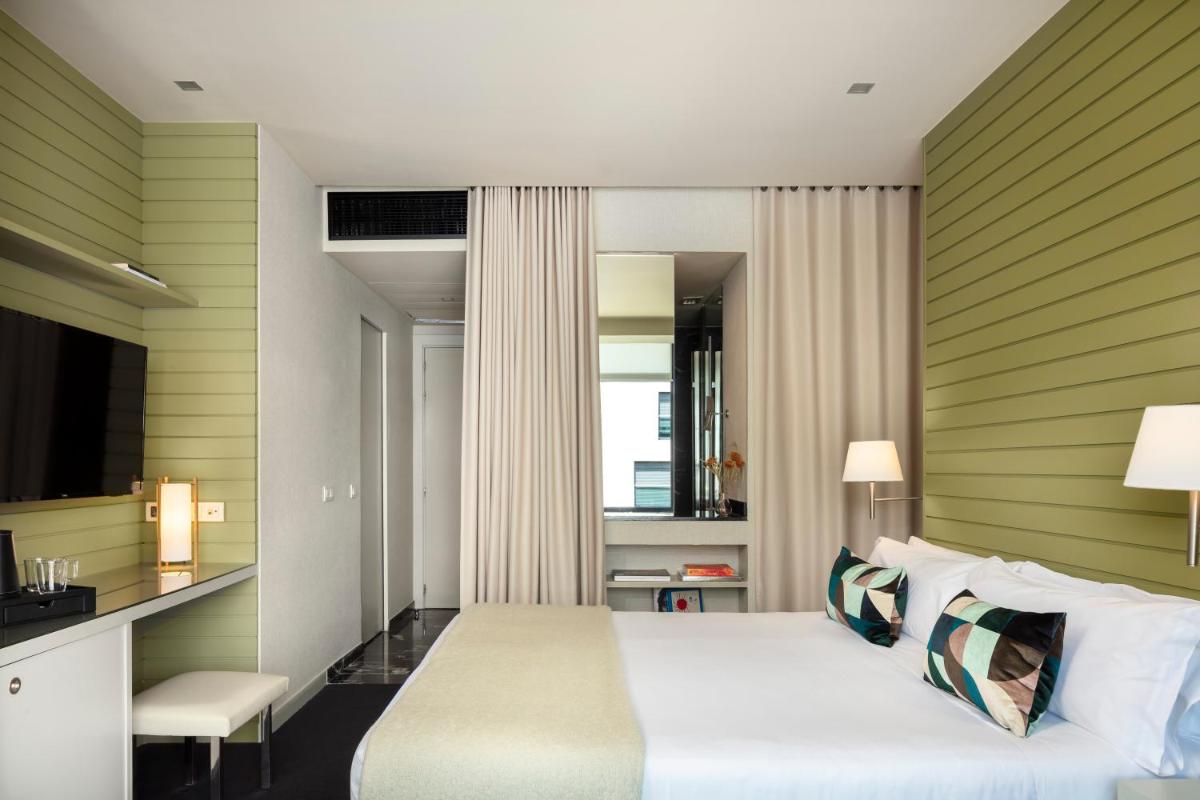 Cama o camas de una habitación en Hotel Miró