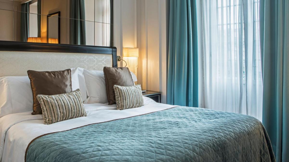 Uma cama ou camas num quarto em InterContinental Porto - Palacio das Cardosas by IHG