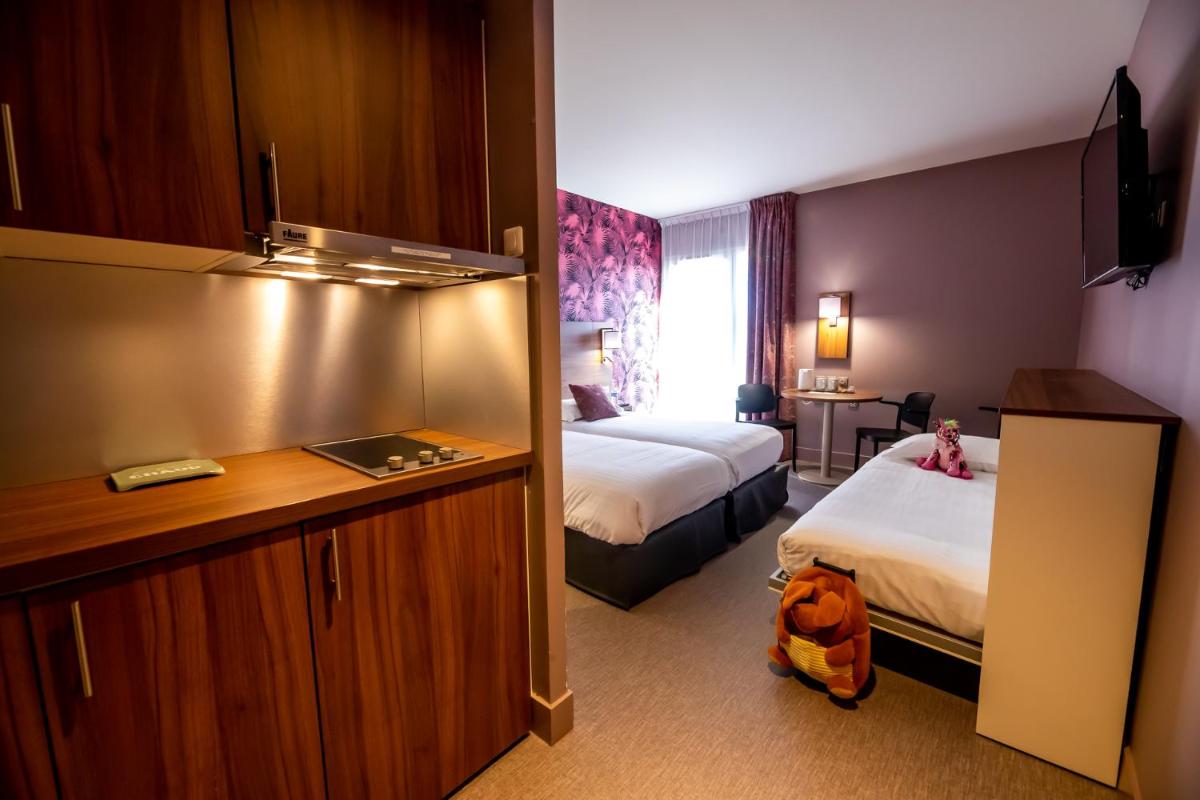 Un ou plusieurs lits dans un hébergement de l'établissement Best Western Eden SPA