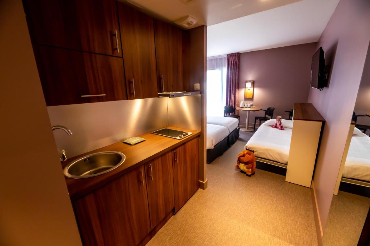 Un ou plusieurs lits dans un hébergement de l'établissement Best Western Eden SPA