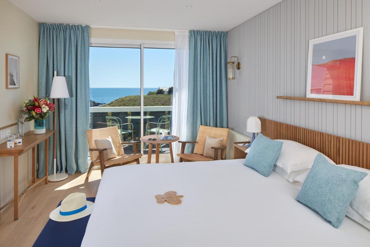 Un ou plusieurs lits dans un hébergement de l'établissement Castel Clara Thalasso & Spa