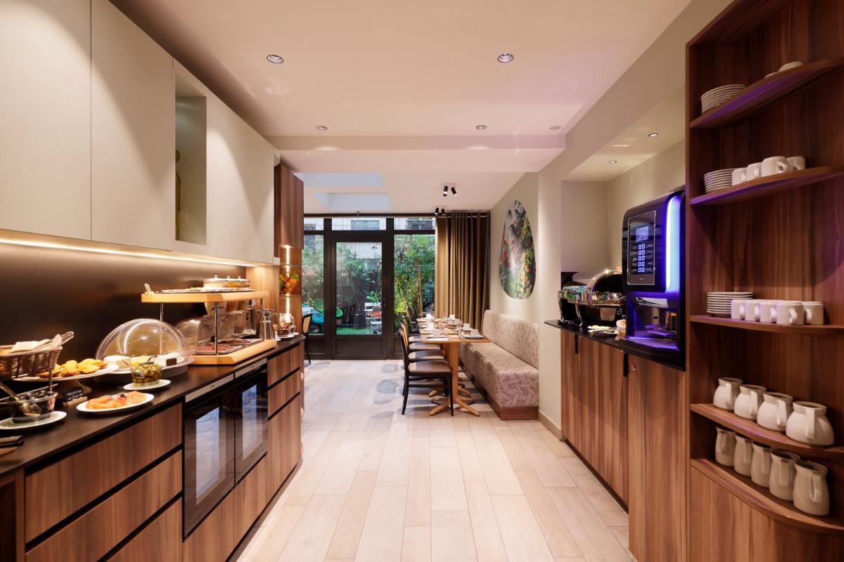 Cuisine ou kitchenette dans l'établissement Hotel Eden