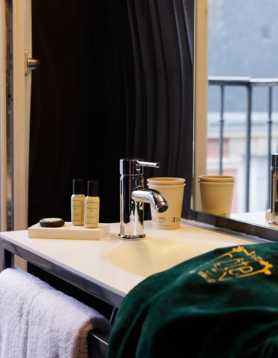 Un ou plusieurs lits dans un hébergement de l'établissement Hotel Eden