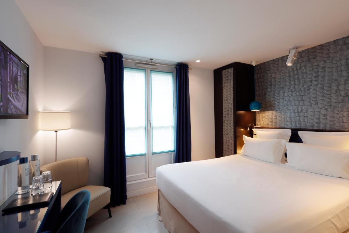 Un ou plusieurs lits dans un hébergement de l'établissement Hotel Eden