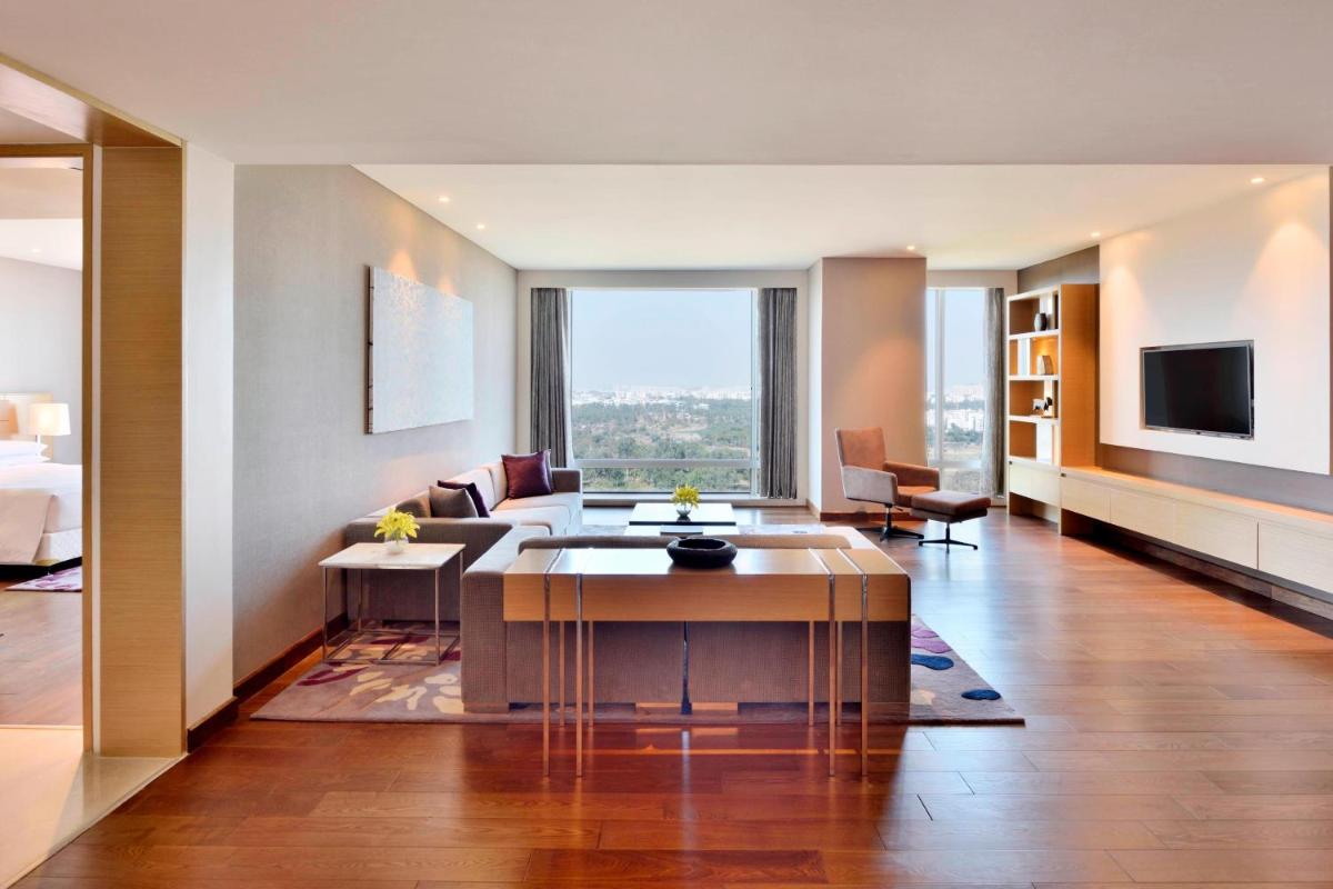 a living room with a couch and a table at Marriott Executive Apartments Hyderabad in Hyderabad