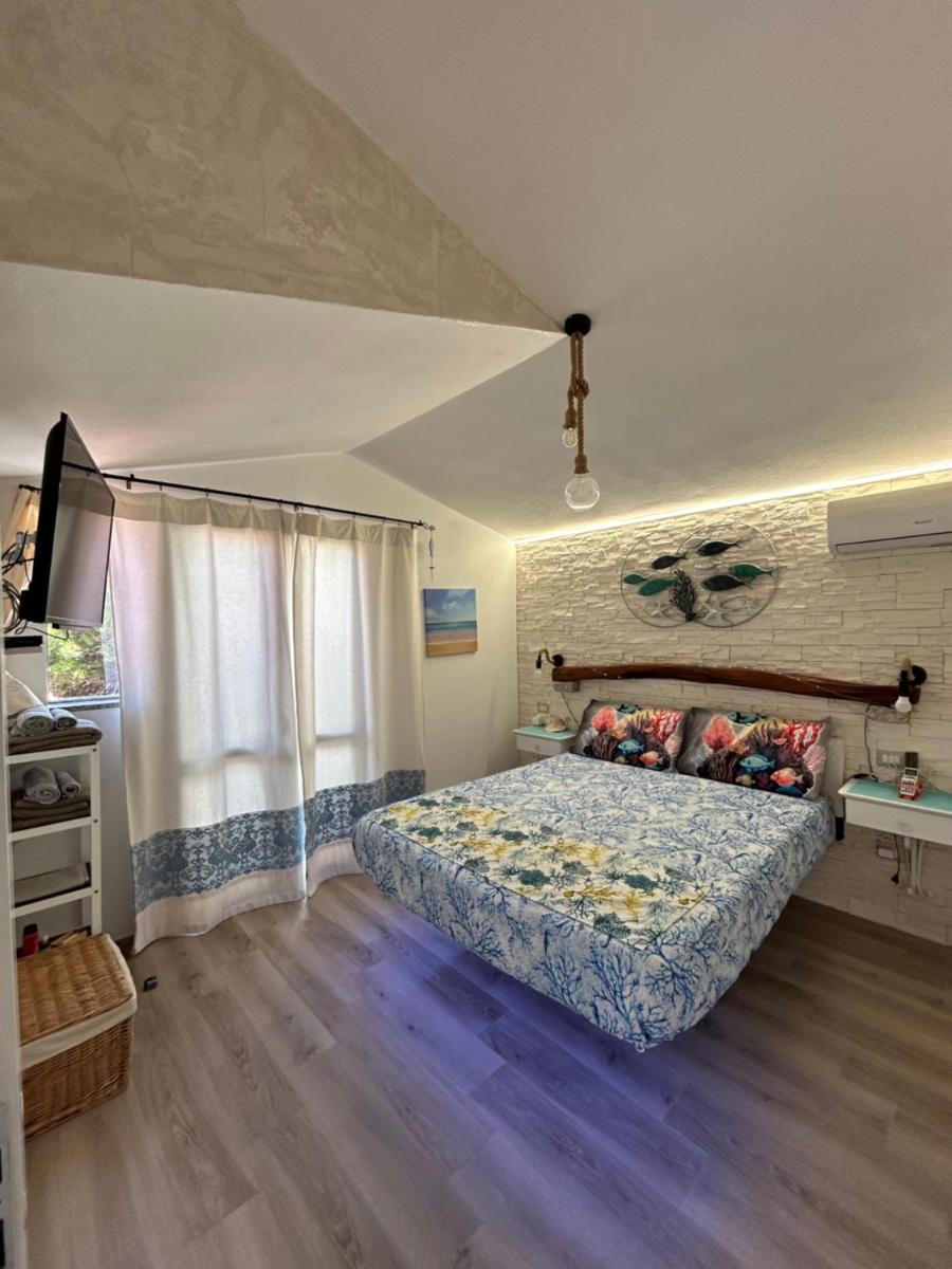 Oasi del Relax - Seaside Peaceful Panoramic Terrace in ITALY - new Sardinia apartment 50 mt beach&sea full comfort air conditioning-WiFi-Parking-Privacy - Housity