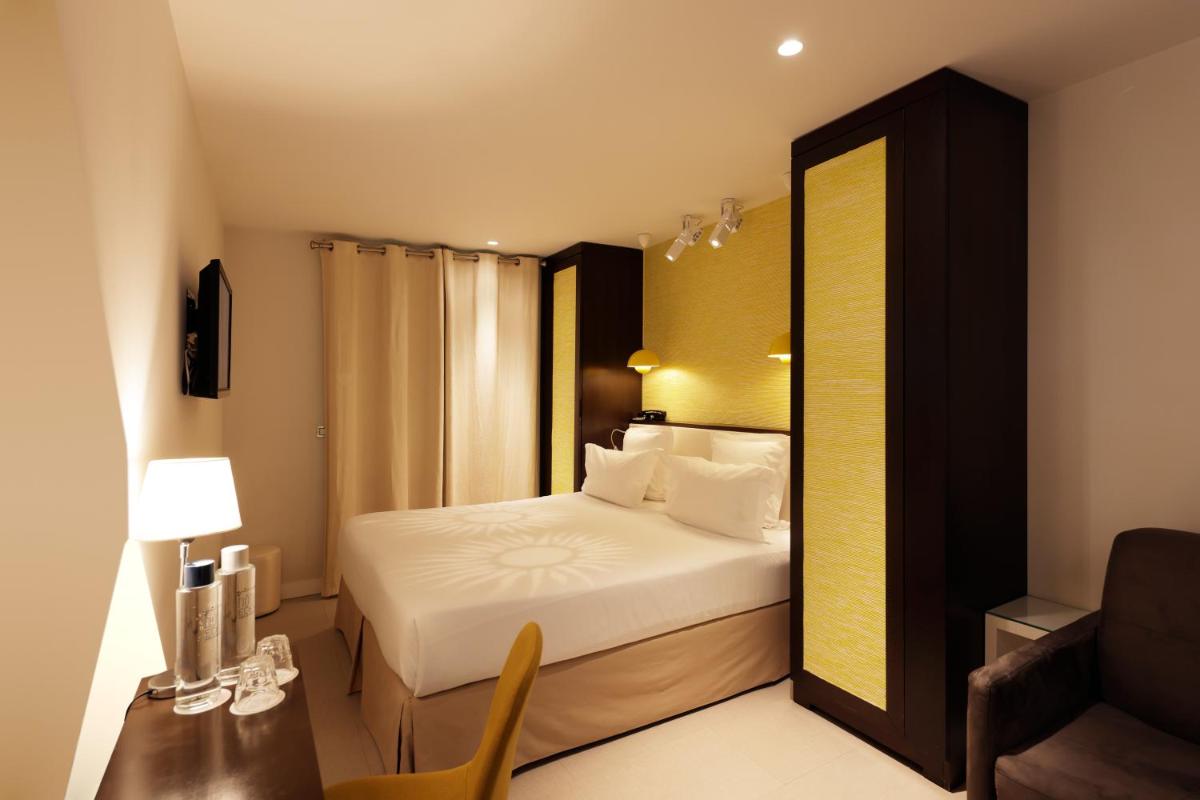Un ou plusieurs lits dans un hébergement de l'établissement Hotel Eden