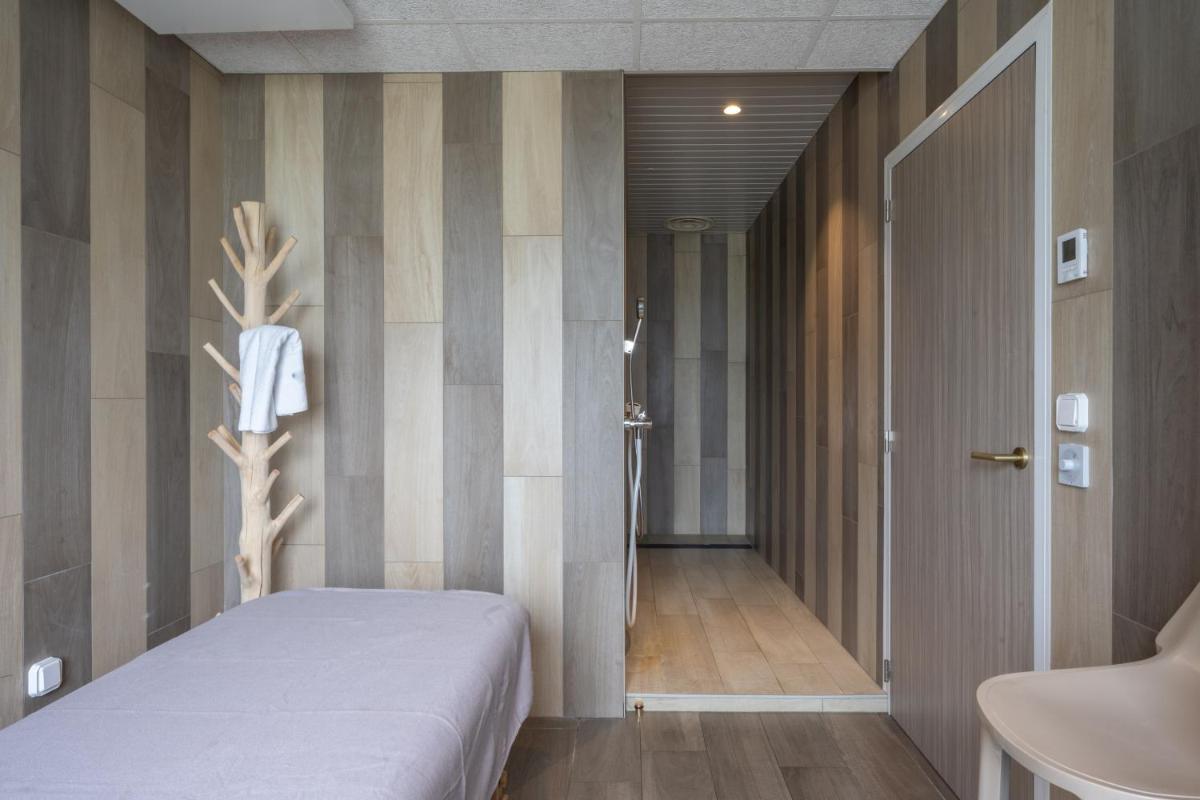 Un ou plusieurs lits dans un hébergement de l'établissement Hôtel Atalante - Relais Thalasso & Spa