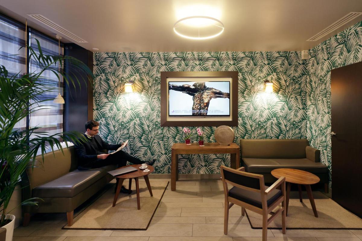 Coin salon dans l'établissement Hotel Eden