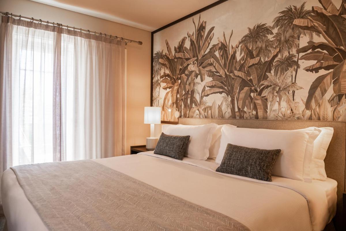 Uma cama ou camas num quarto em Domes Lake Algarve, Autograph Collection