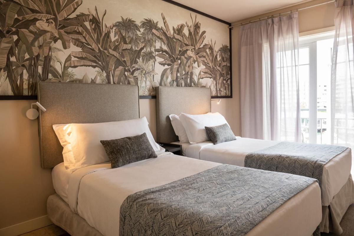 Uma cama ou camas num quarto em Domes Lake Algarve, Autograph Collection