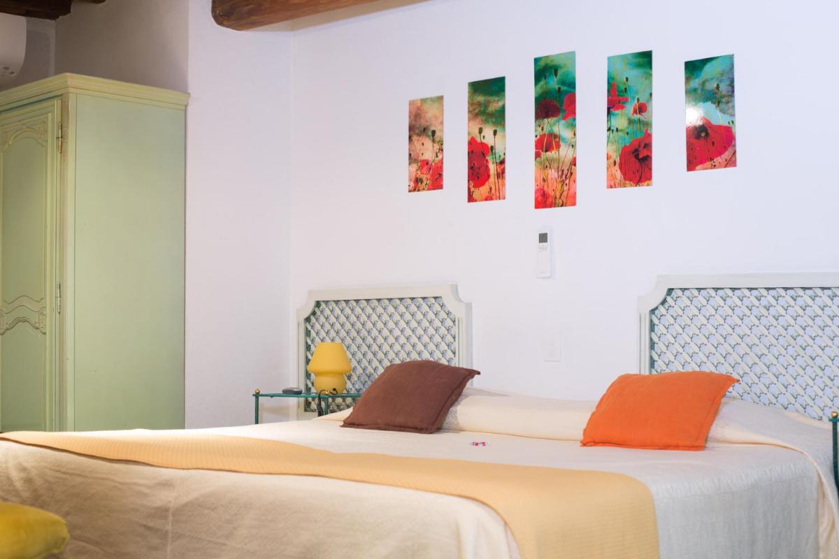 Un ou plusieurs lits dans un hébergement de l'établissement Le Castellas Hotel & SPA - TERITORIA
