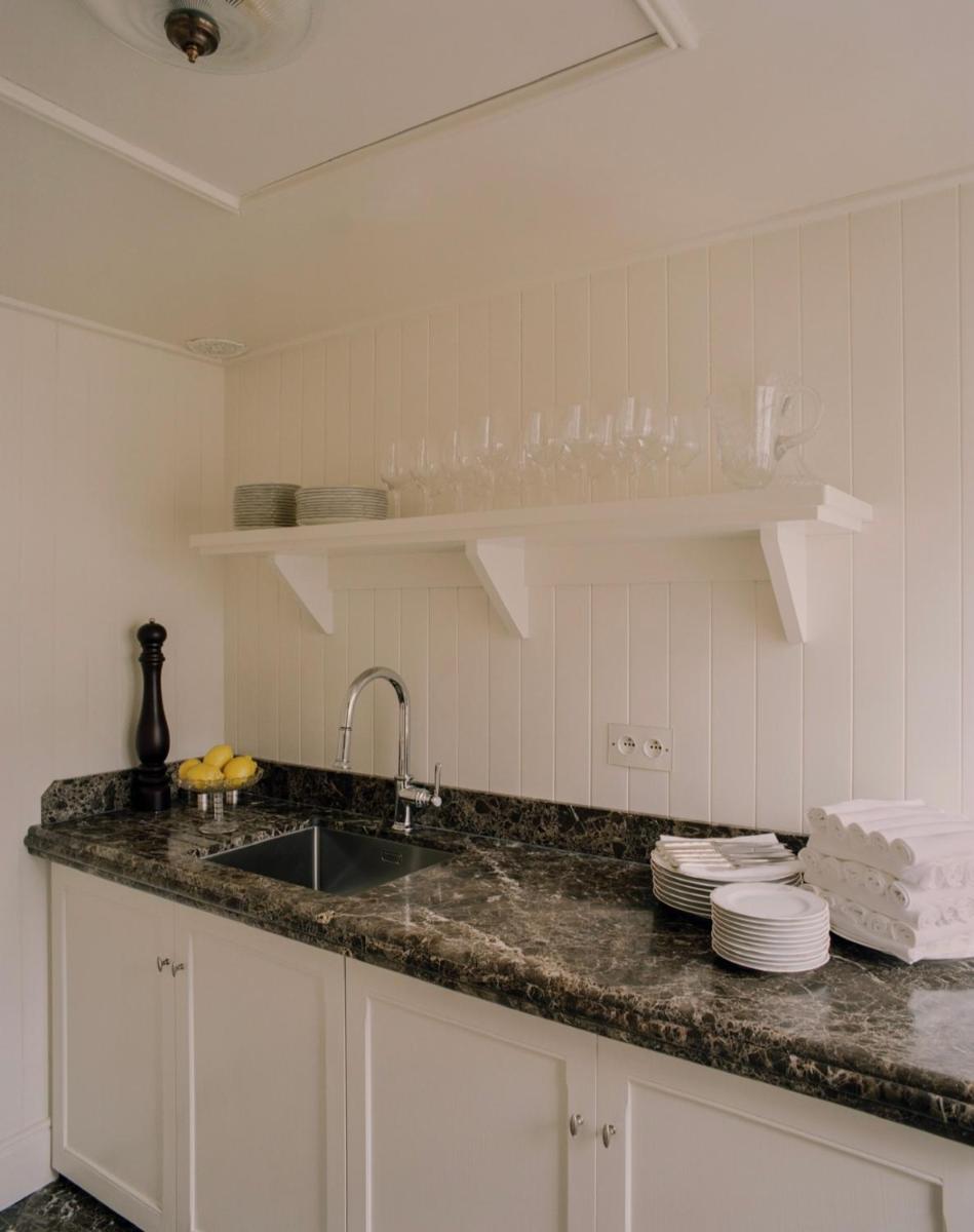 Cuisine ou kitchenette dans l'établissement Château Voltaire