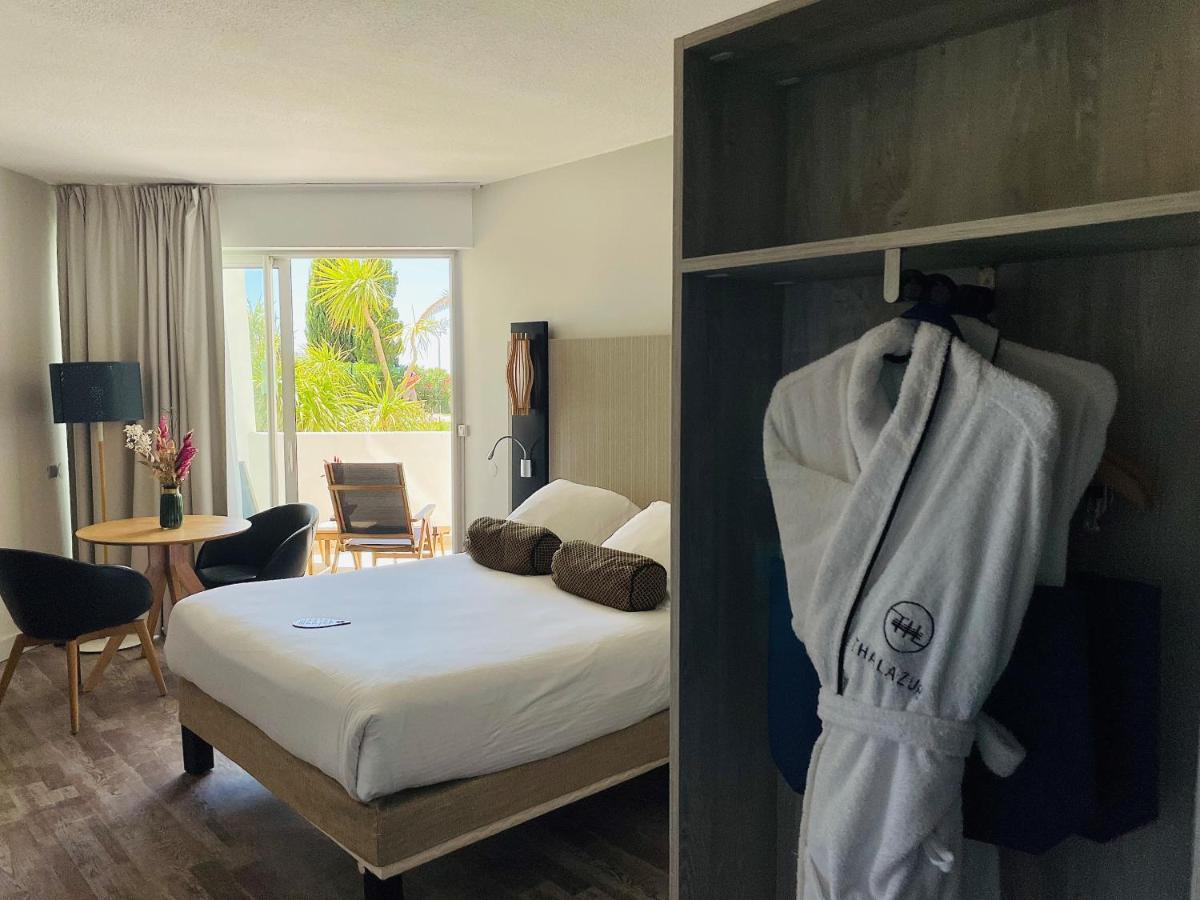 Un ou plusieurs lits dans un hébergement de l'établissement Thalazur Port-Camargue - Hotel & Spa