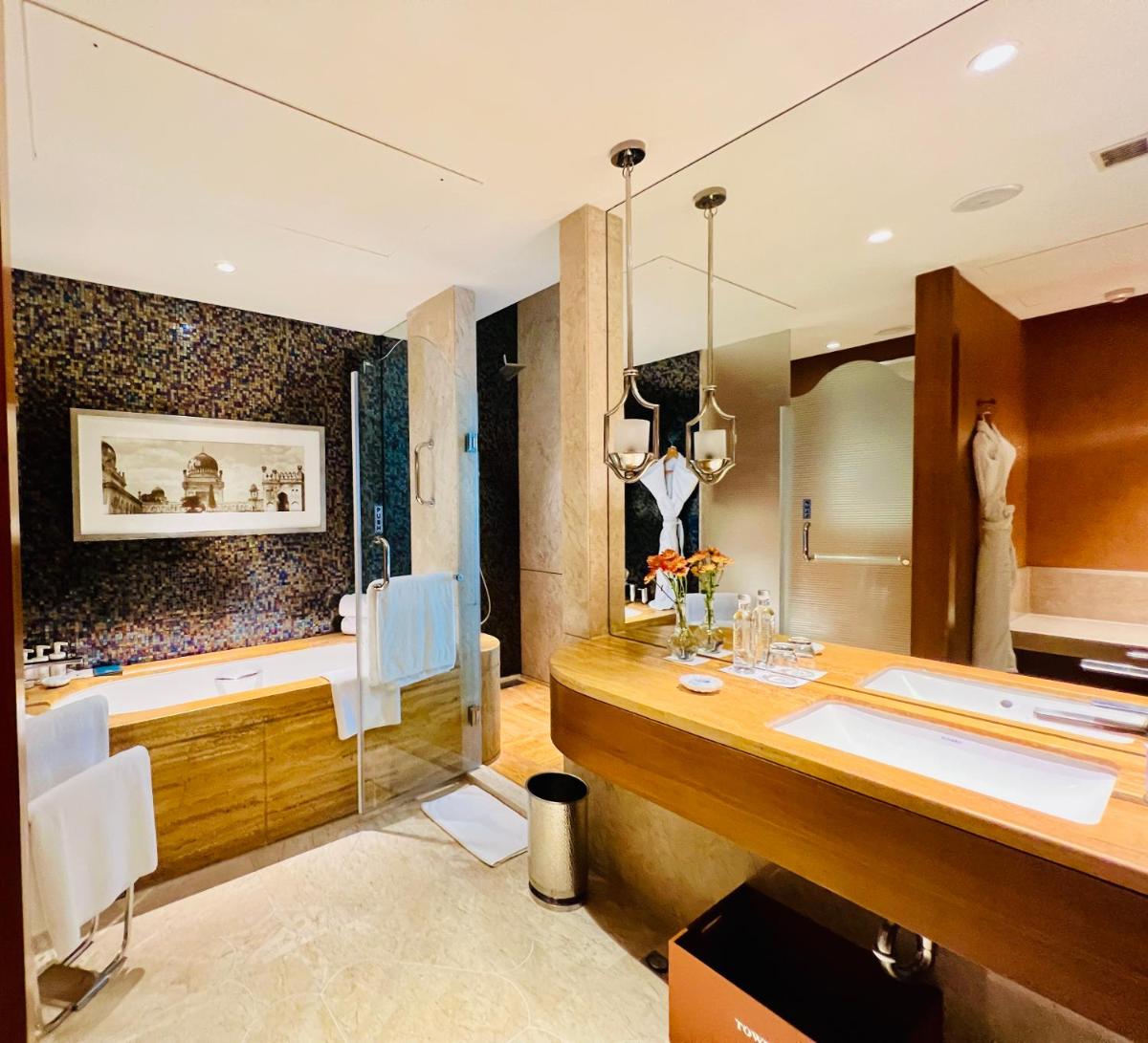 a bathroom with a tub and a sink at ITC Kohenur, a Luxury Collection Hotel, Hyderabad in Hyderabad