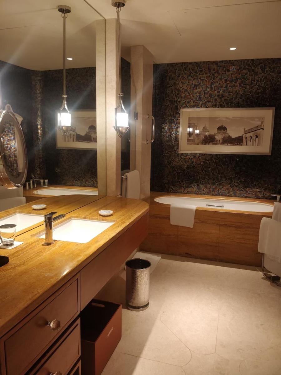 a bathroom with a sink and a bath tub at ITC Kohenur, a Luxury Collection Hotel, Hyderabad in Hyderabad