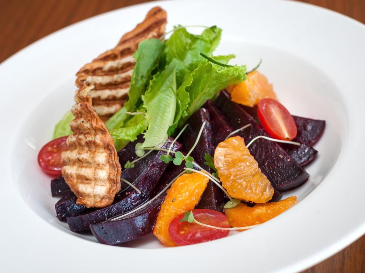 a white plate of food with vegetables and toast at Hyatt Place Pune Hinjawadi in Pune