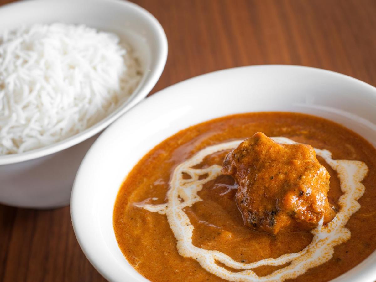 a bowl of soup and a bowl of white rice at Hyatt Place Pune Hinjawadi in Pune