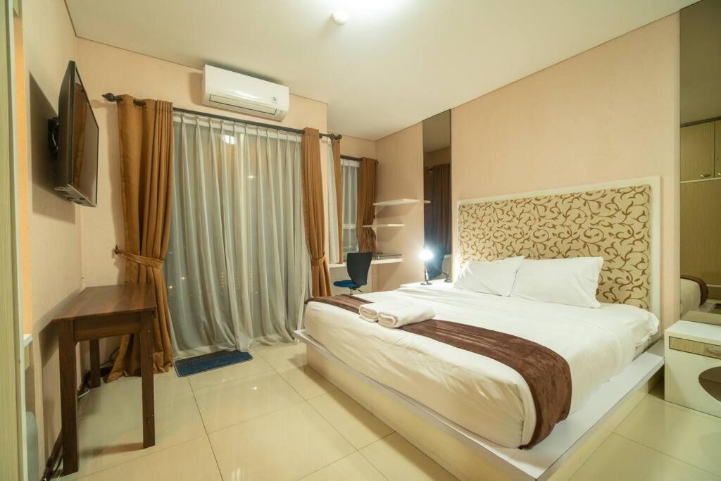 2BR at central city view Thamrin residence Netflix - Housity