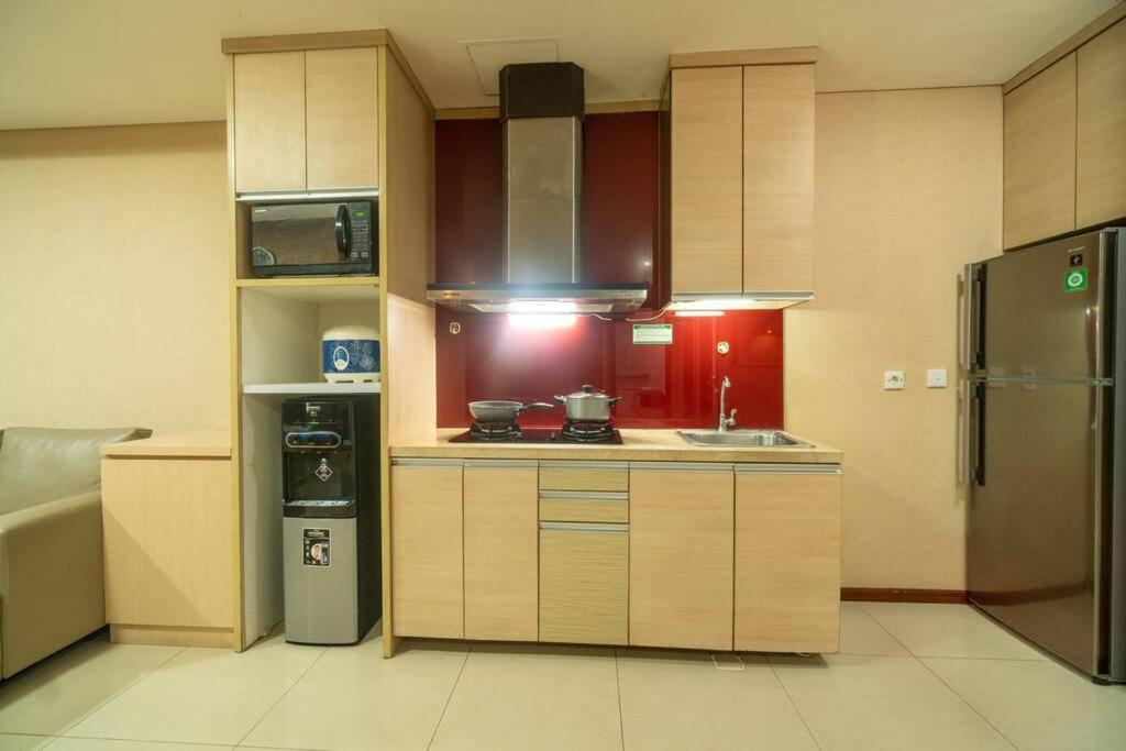 2BR at central city view Thamrin residence Netflix - Housity