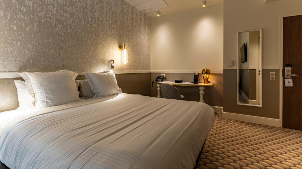 Un ou plusieurs lits dans un hébergement de l'établissement Continental Hotel