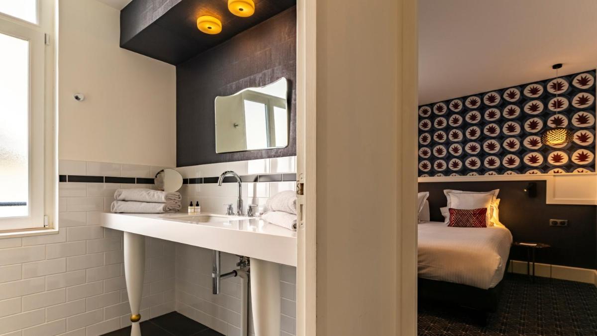 Un ou plusieurs lits dans un hébergement de l'établissement Continental Hotel
