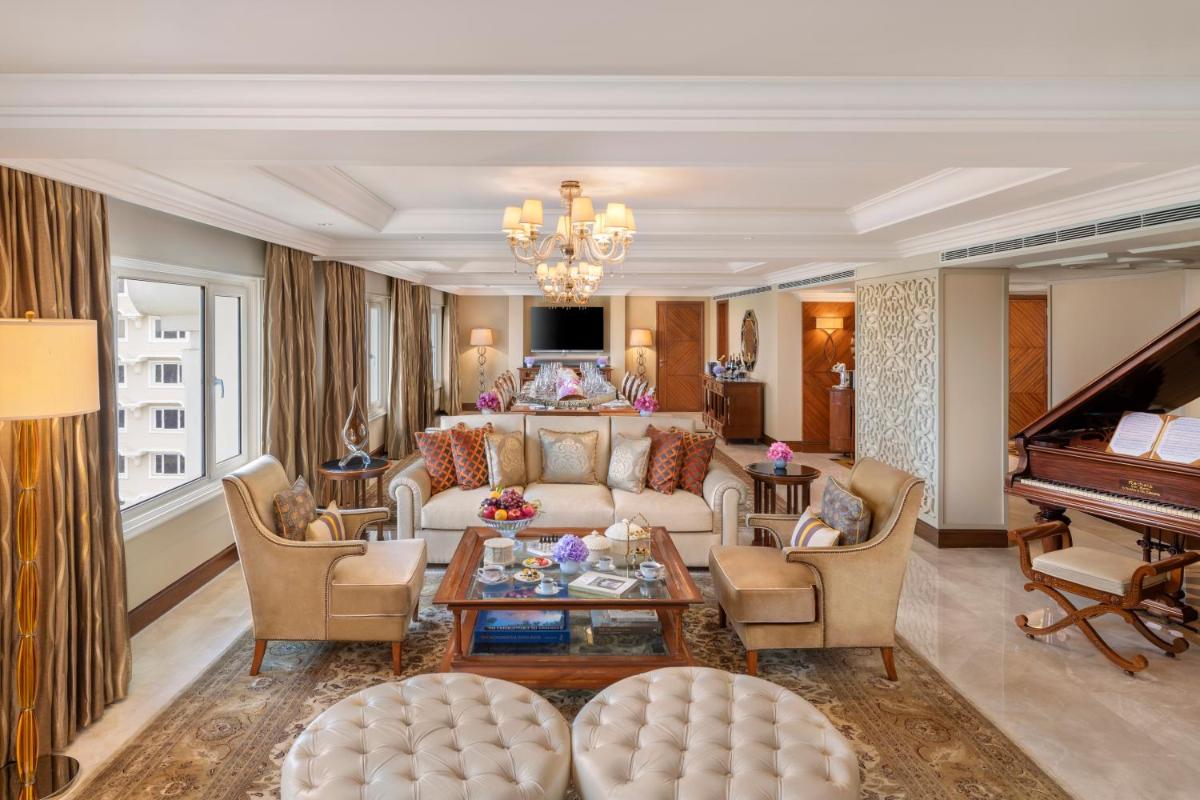 a living room with a couch and a piano at Taj Palace, New Delhi in New Delhi a living room with a couch and a piano at Taj Palace, New Delhi in New Delhi