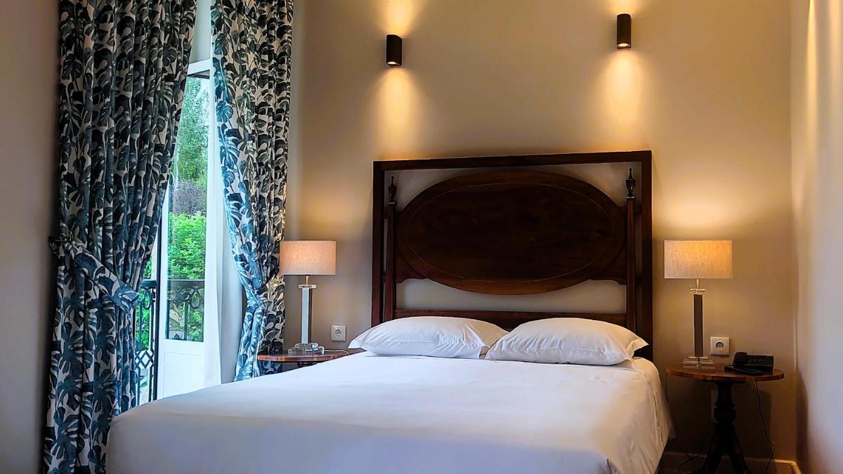Uma cama ou camas num quarto em Grande Hotel das Caldas da Felgueira