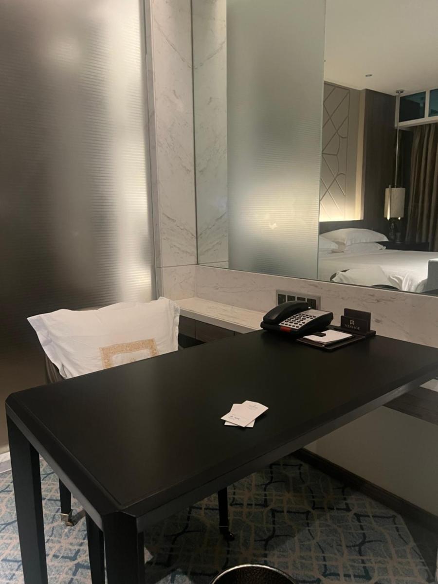 a black table in a room with a mirror at ITC Kohenur, a Luxury Collection Hotel, Hyderabad in Hyderabad