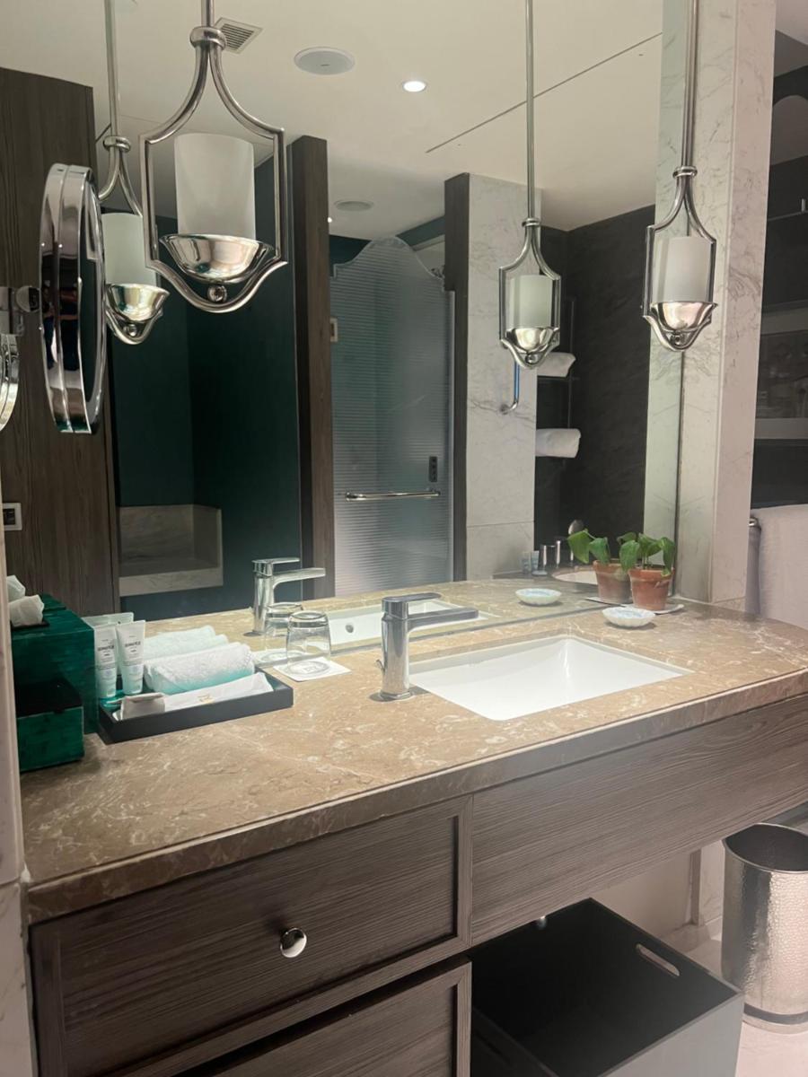 a bathroom with a sink and a large mirror at ITC Kohenur, a Luxury Collection Hotel, Hyderabad in Hyderabad