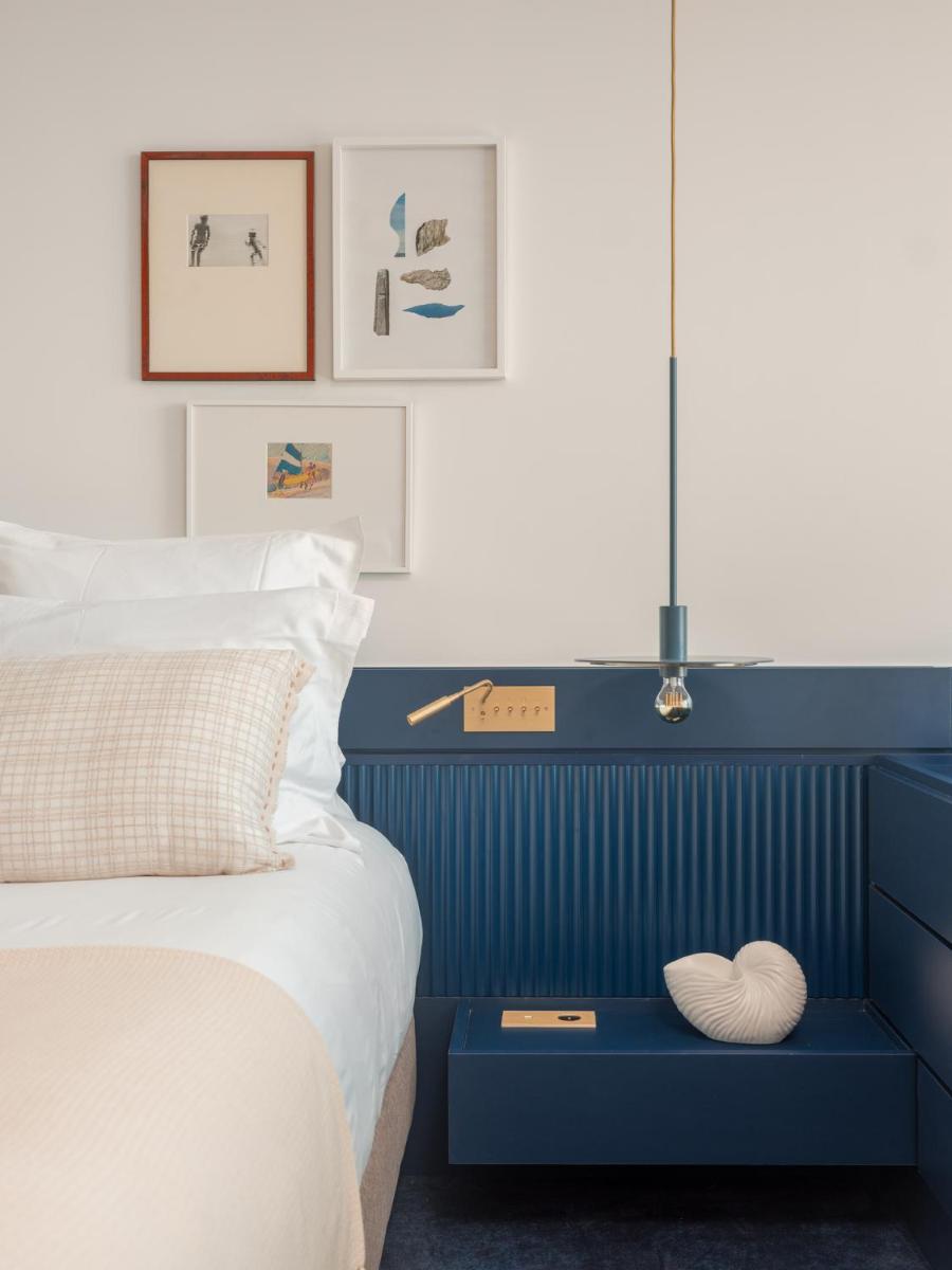 Un ou plusieurs lits dans un hébergement de l'établissement Bleu Hôtel & Spa