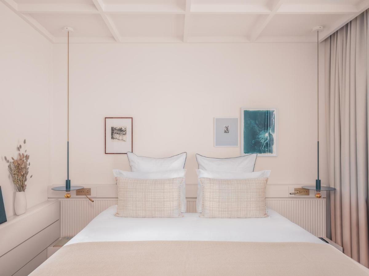 Un ou plusieurs lits dans un hébergement de l'établissement Bleu Hôtel & Spa