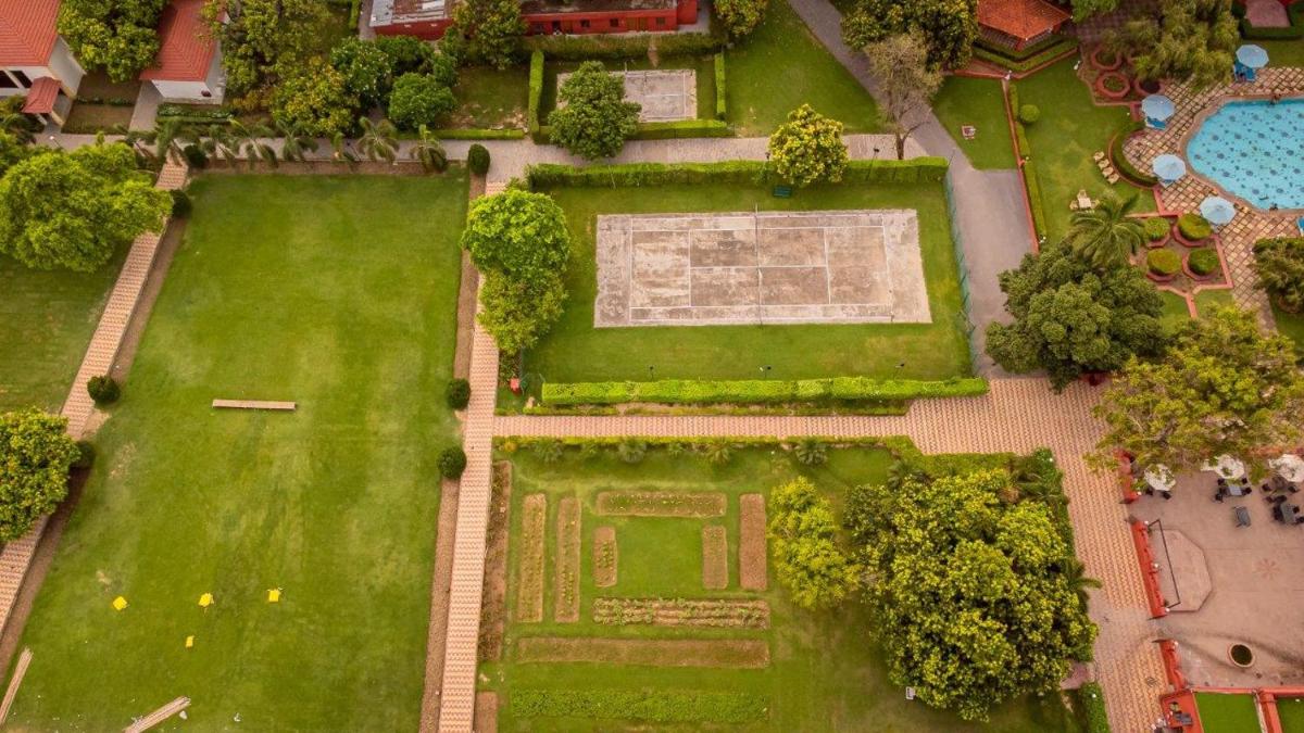an overhead view of a garden with a park at Taj Ganges Varanasi in Varanasi