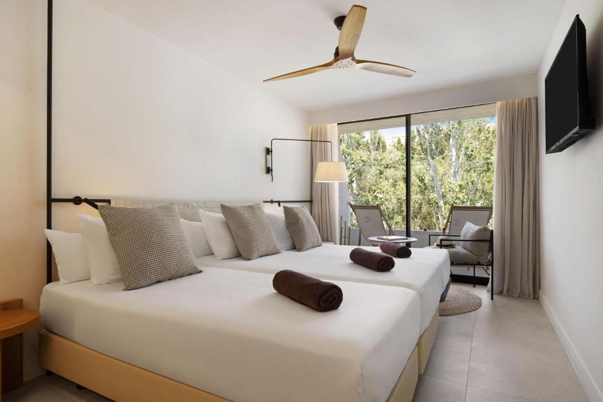Cama o camas de una habitación en Inmood Aucanada 4 Sup