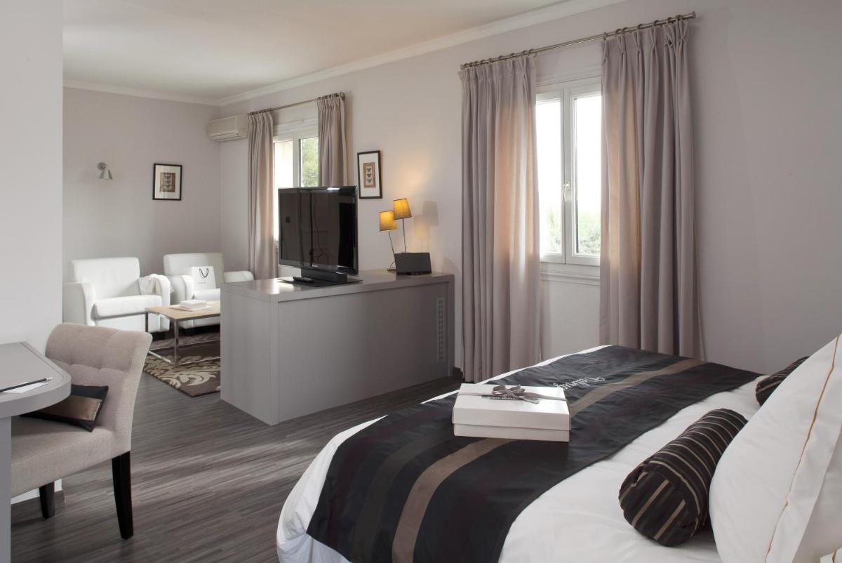 Un ou plusieurs lits dans un hébergement de l'établissement Le Vallon de Valrugues Hotel Spa & Villas