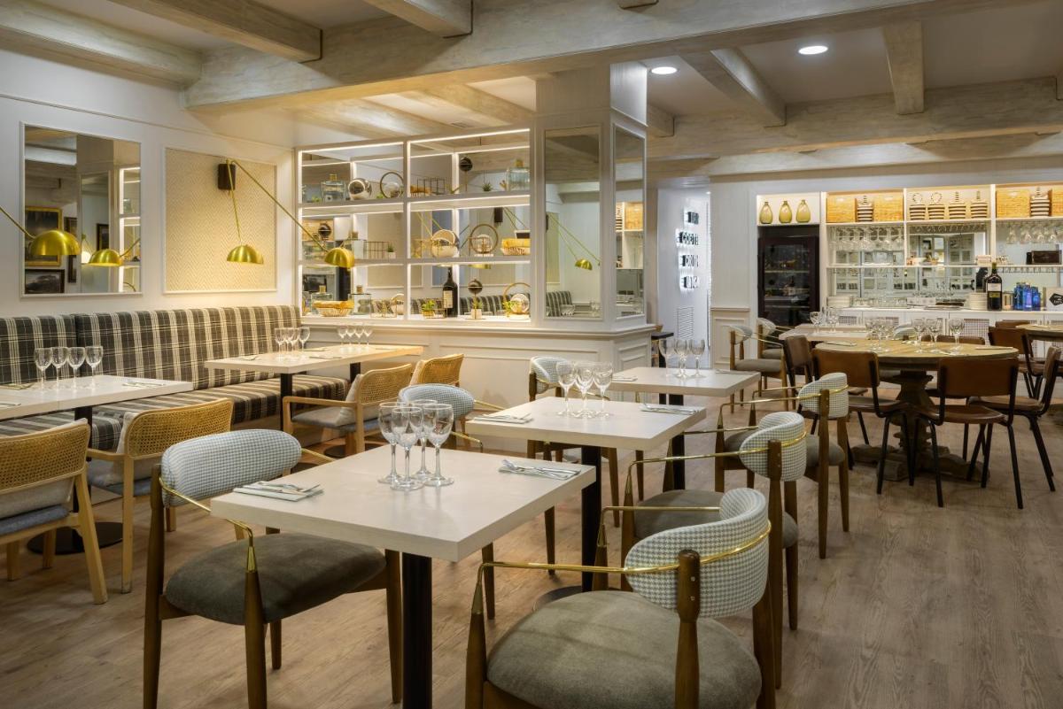 Un restaurante o sitio para comer en Oroel Hotel & SPA