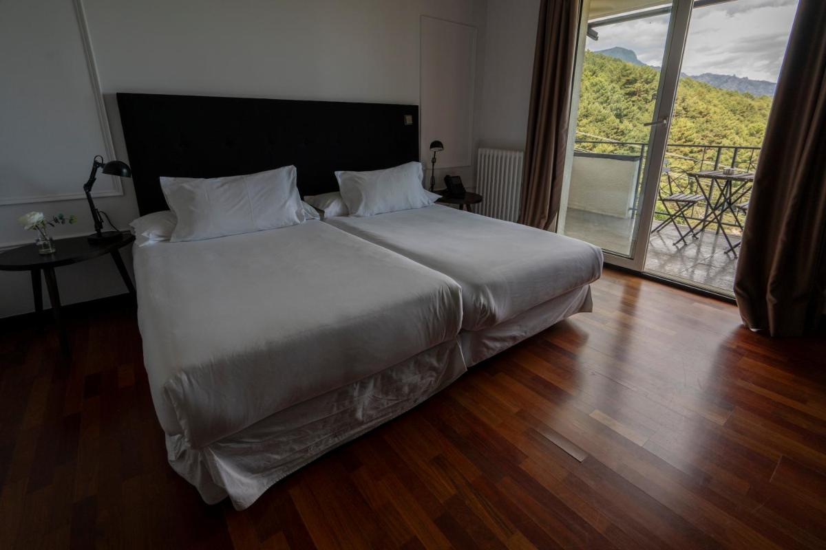 Cama o camas de una habitación en Hotel Hita "Nature Experience" for all