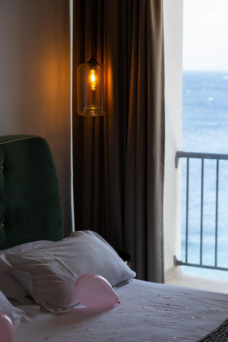 Un ou plusieurs lits dans un hébergement de l'établissement Hotel La Pietra Restaurant & Spa