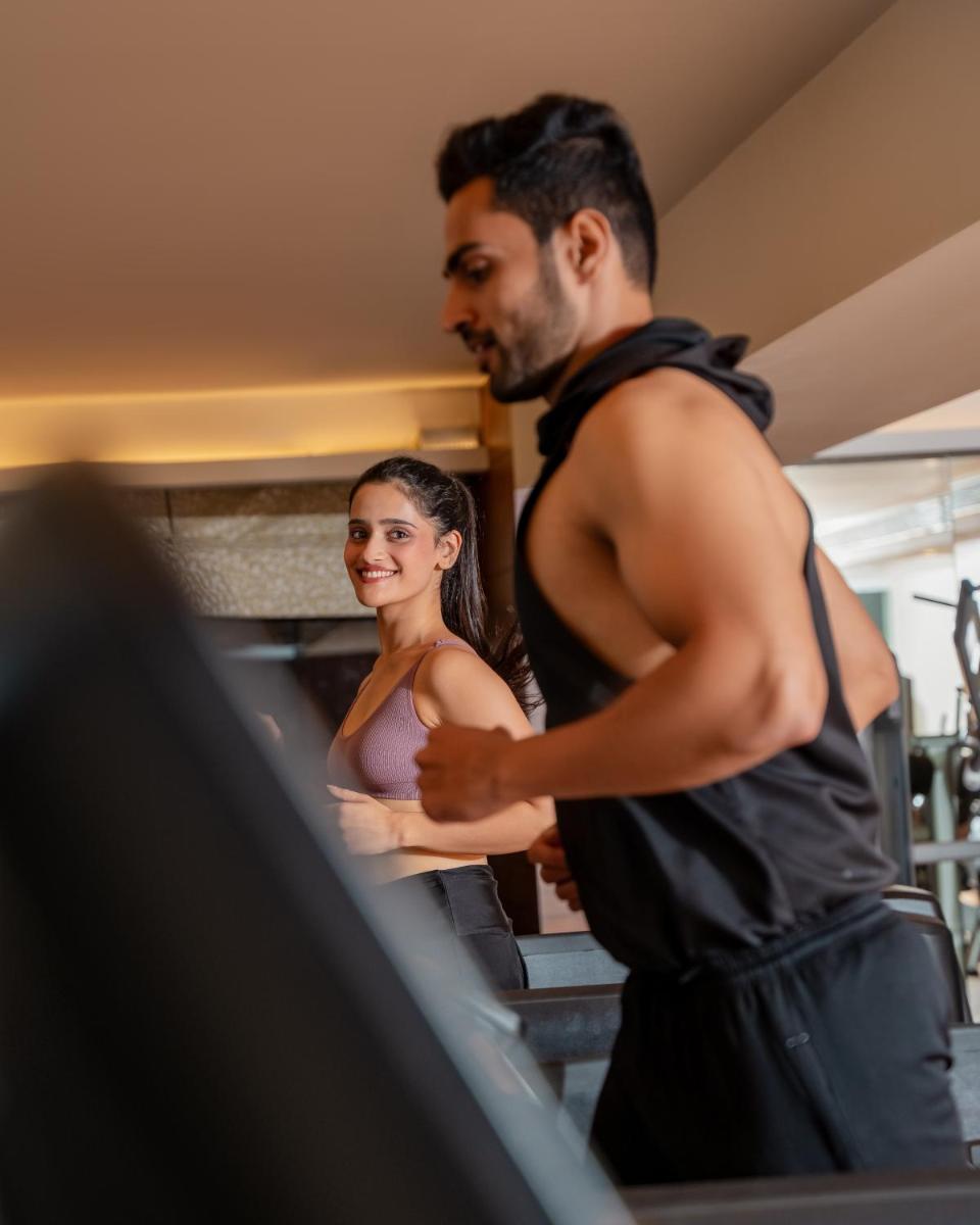a man and a woman standing in a kitchen at Hyatt Pune in Pune