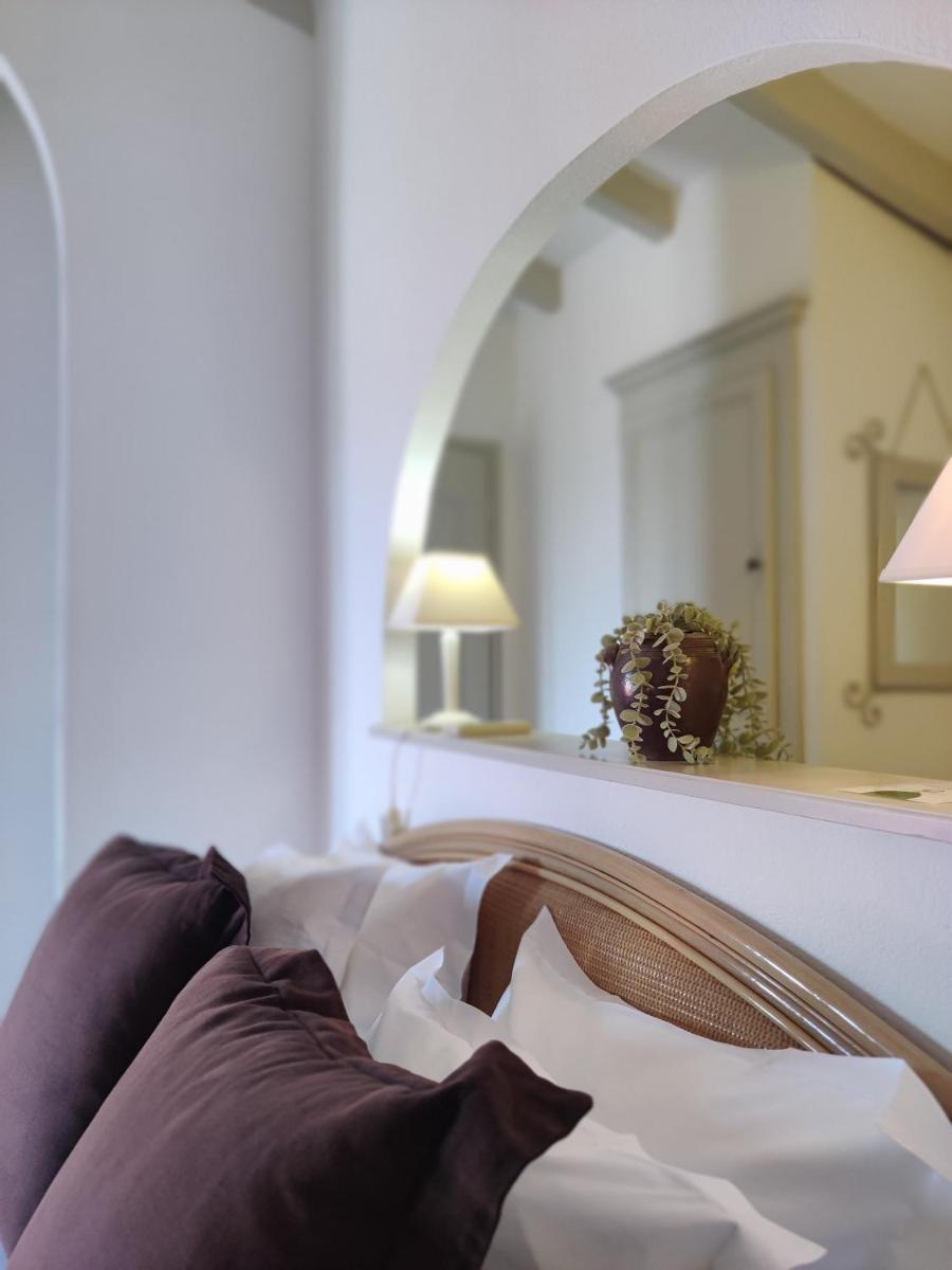 Un ou plusieurs lits dans un hébergement de l'établissement Le Roc E Fiori Hotel - Teritoria