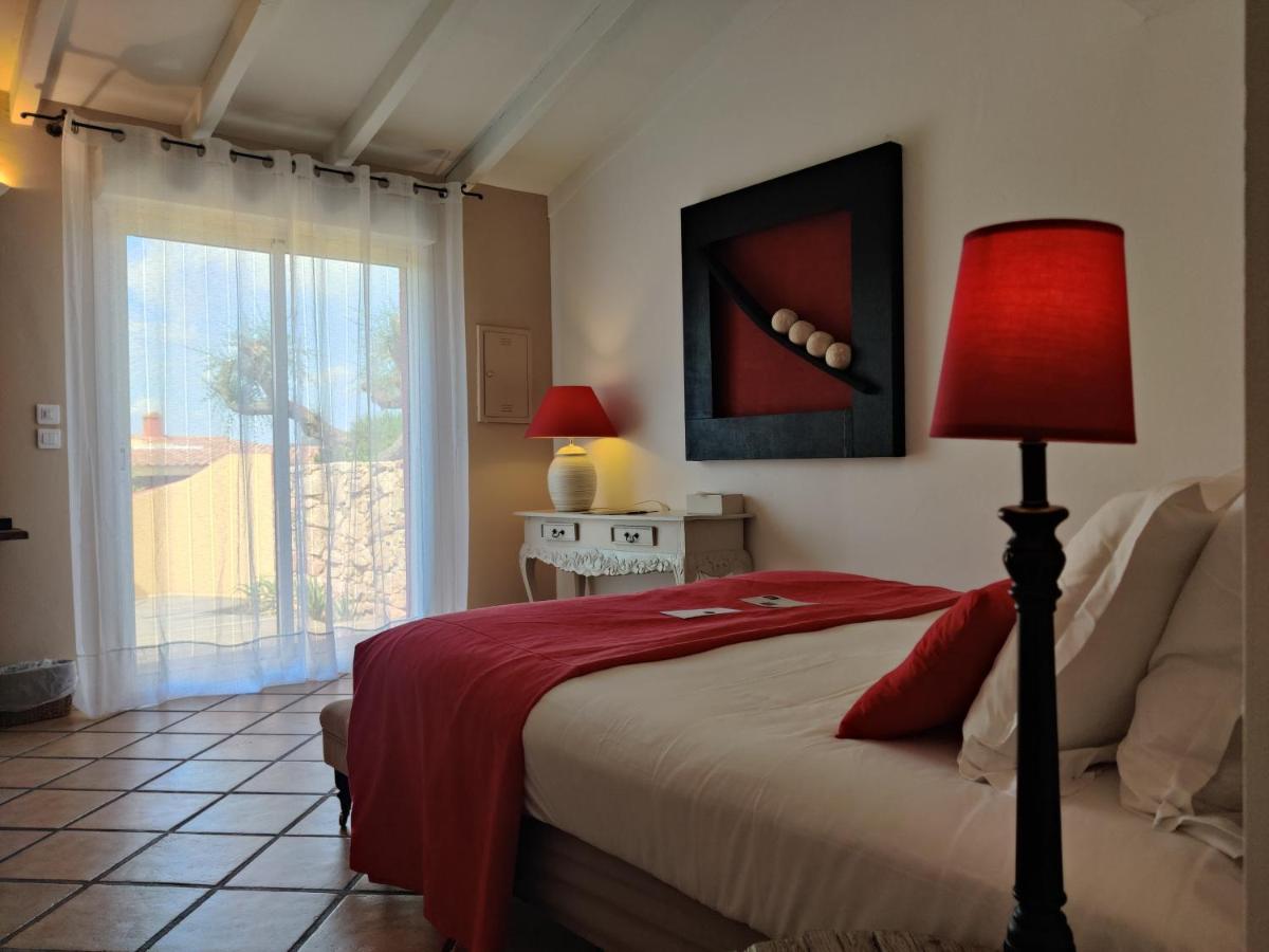 Un ou plusieurs lits dans un hébergement de l'établissement Le Roc E Fiori Hotel - Teritoria
