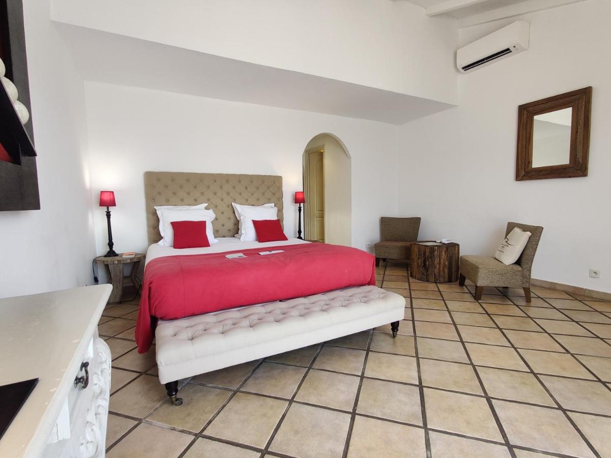 Un ou plusieurs lits dans un hébergement de l'établissement Le Roc E Fiori Hotel - Teritoria