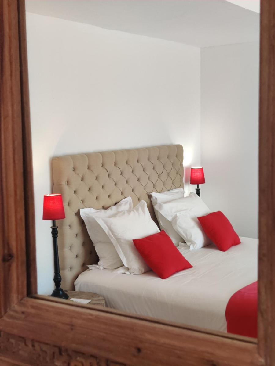 Un ou plusieurs lits dans un hébergement de l'établissement Le Roc E Fiori Hotel - Teritoria