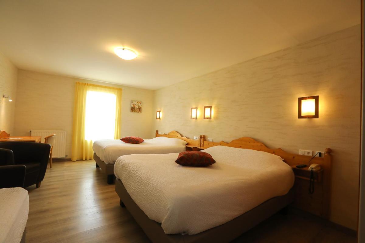Un ou plusieurs lits dans un hébergement de l'établissement Logis Hotel Spa Restaurant Le Provence